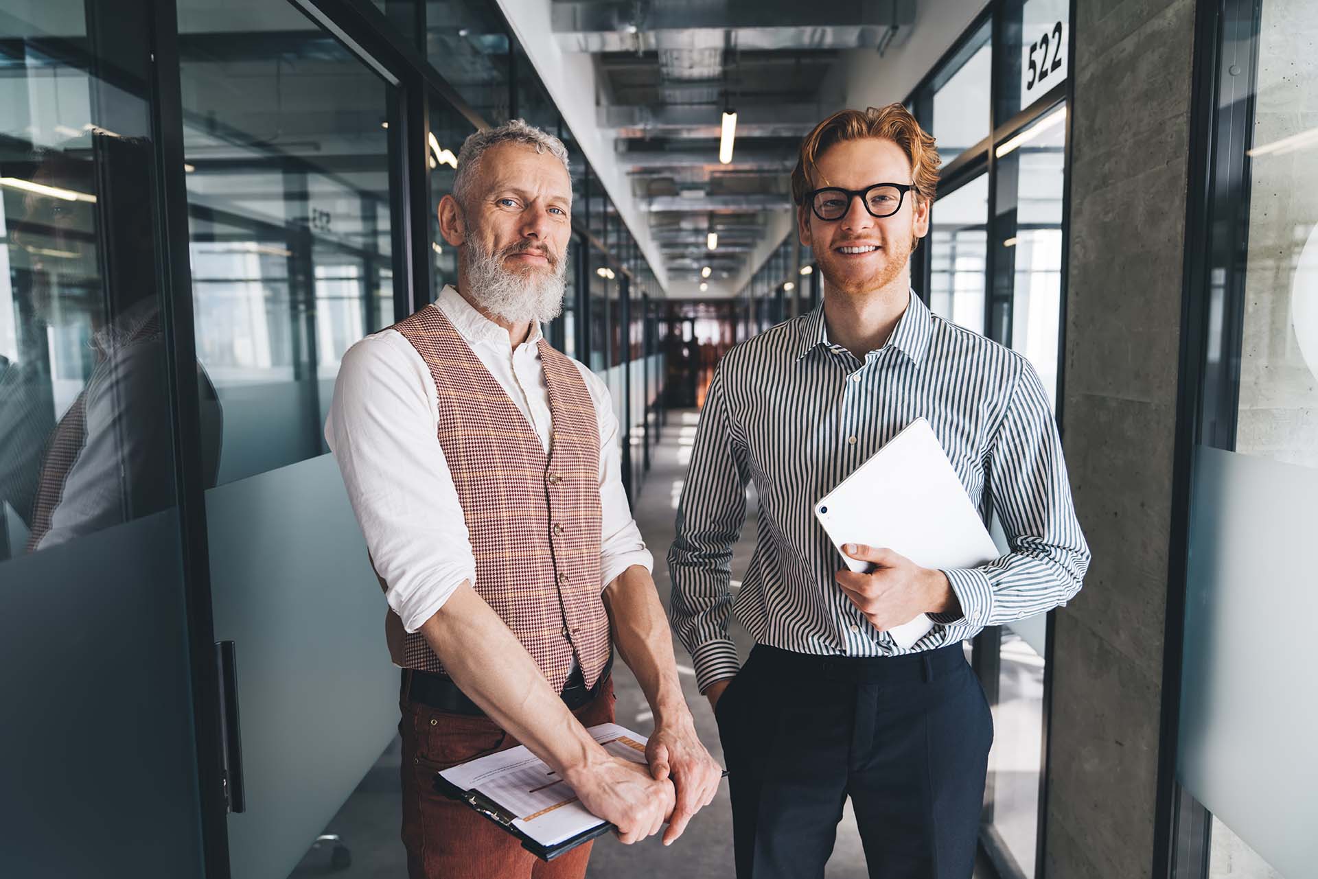 Portrait of Caucasian male colleagues during working day with to